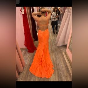 the color is like a peach/orange and it has the train pined up
